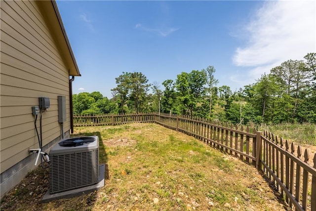 view of yard with cooling unit and a fenced backyard