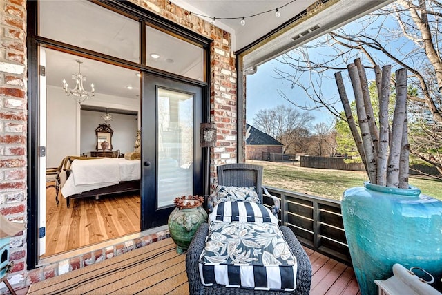 wooden terrace featuring fence and a lawn