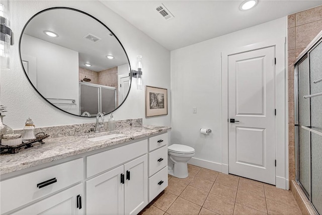 full bath featuring tile patterned flooring, vanity, visible vents, and a stall shower