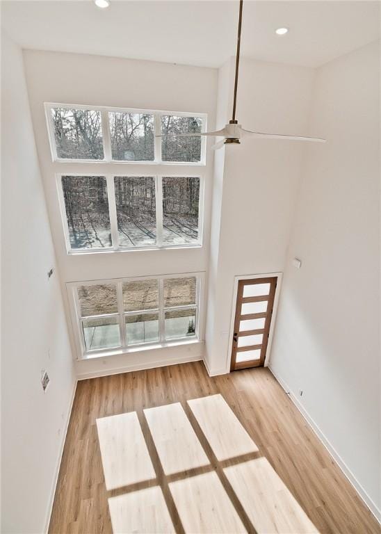 interior space with recessed lighting, baseboards, and wood finished floors