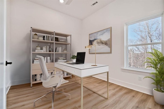 office featuring wood finished floors, visible vents, and baseboards