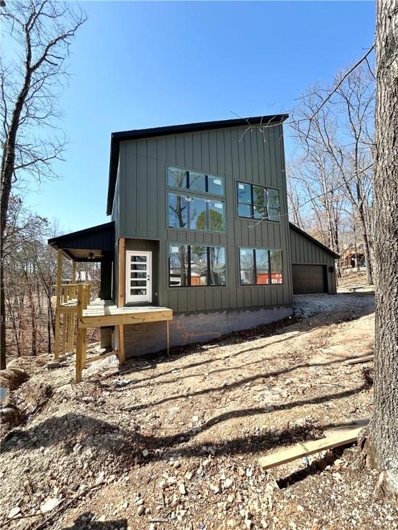 exterior space with an attached garage and board and batten siding