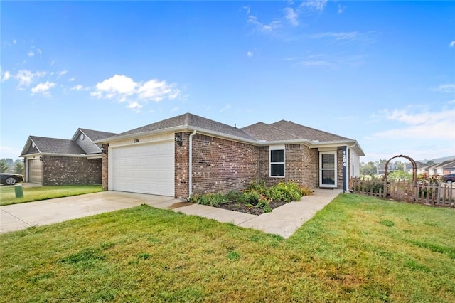 single story home with a garage, driveway, a front lawn, and brick siding