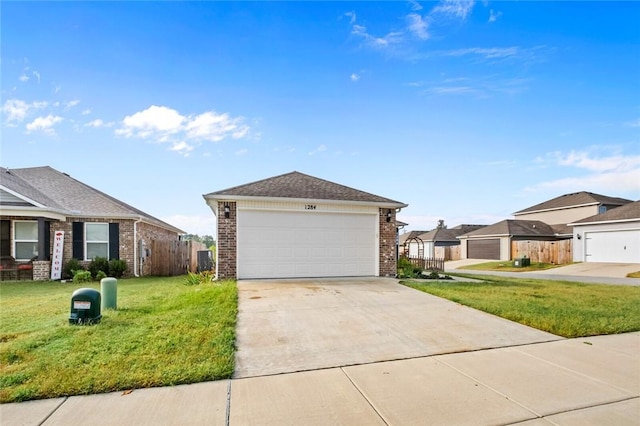 view of front of property with brick siding, fence, driveway, and a front lawn