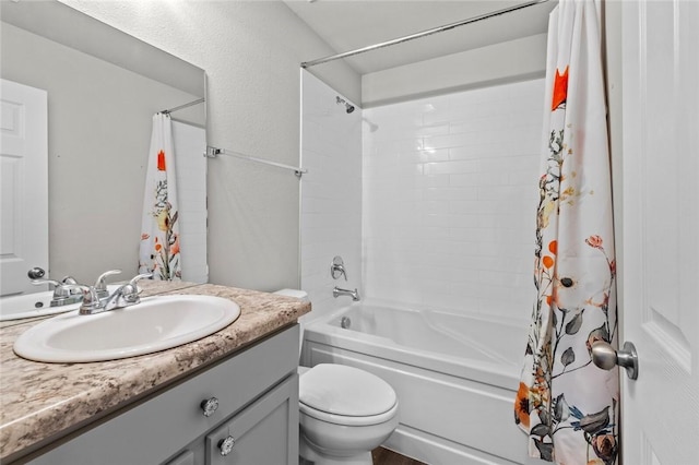 full bathroom featuring shower / tub combo, vanity, and toilet