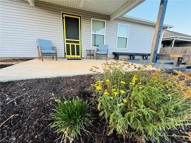 view of patio / terrace featuring fence