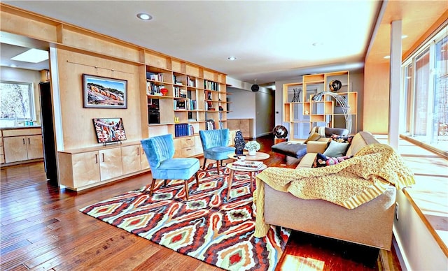 living area with recessed lighting and wood finished floors