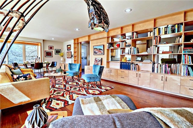 living area with recessed lighting and wood finished floors