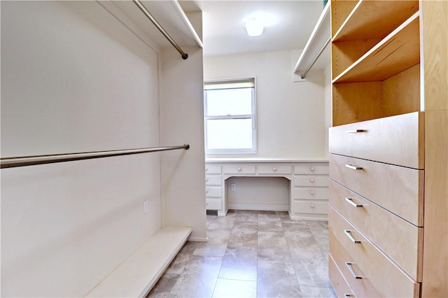 walk in closet with built in study area