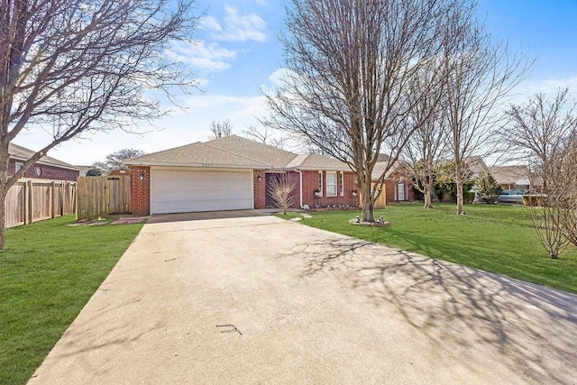 single story home featuring a garage, driveway, brick siding, and a front lawn