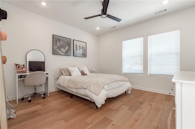 bedroom featuring ceiling fan, recessed lighting, visible vents, baseboards, and light wood-style floors