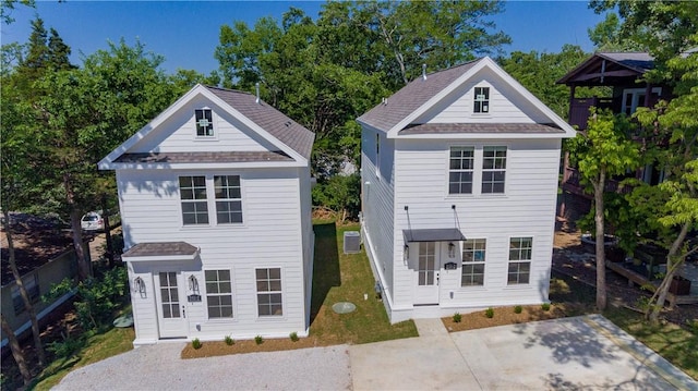 view of front of house featuring a patio and fence