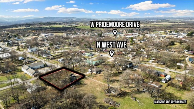 birds eye view of property featuring a mountain view