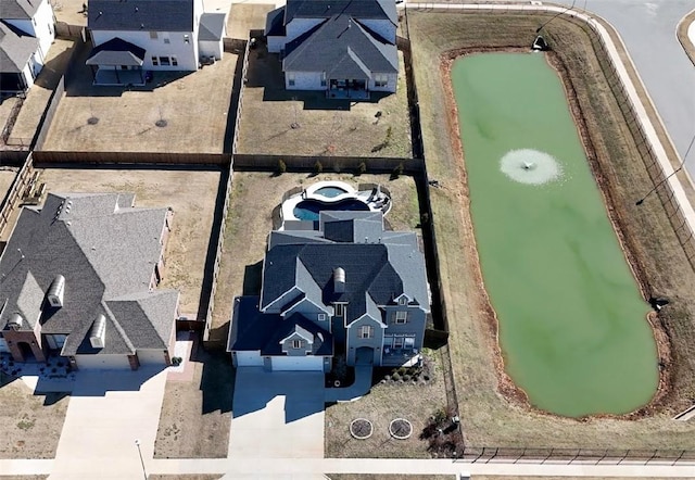 birds eye view of property with a residential view