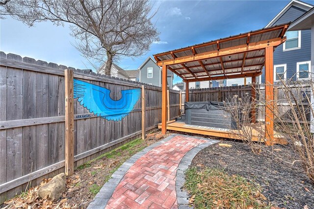 view of patio featuring a deck and a fenced backyard