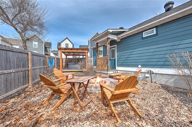 view of patio / terrace featuring a fire pit, a fenced backyard, and a pergola