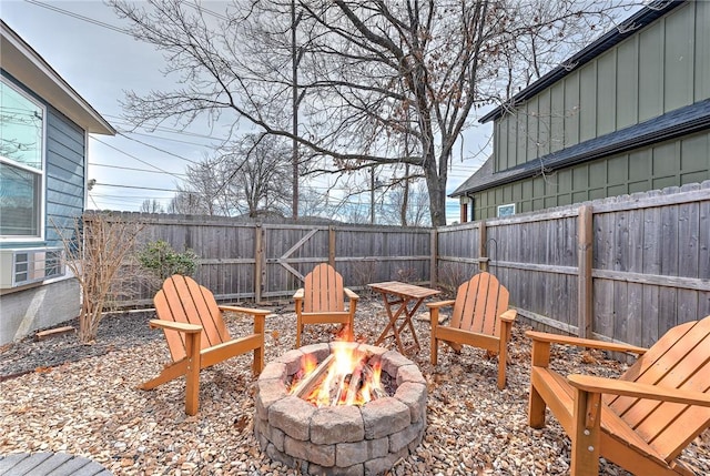 view of patio featuring a fire pit and a fenced backyard