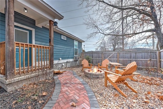 view of patio with a fire pit and fence