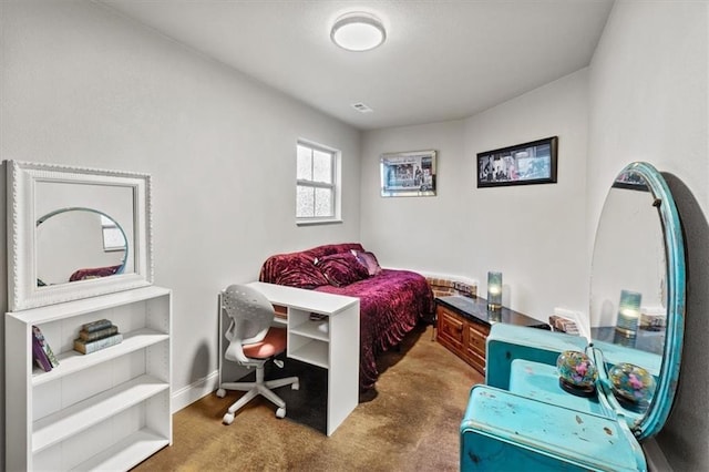 carpeted bedroom featuring visible vents and baseboards