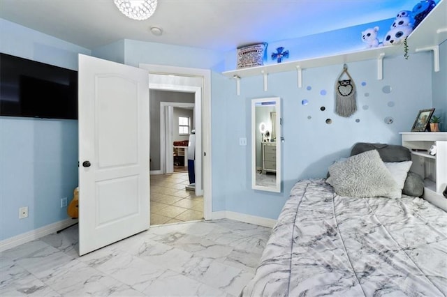 bedroom featuring marble finish floor and baseboards