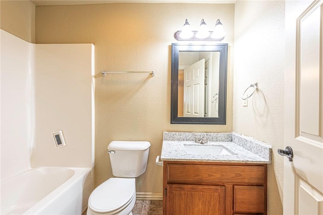 full bath with washtub / shower combination, vanity, and toilet