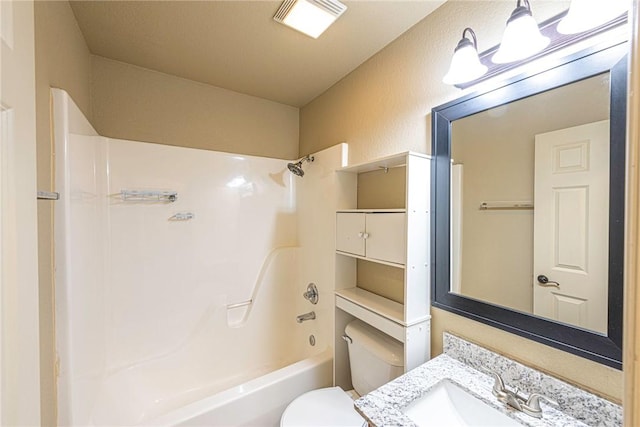 full bath featuring shower / bath combination, a textured wall, vanity, and toilet