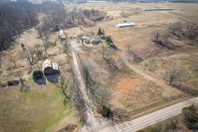 birds eye view of property with a rural view