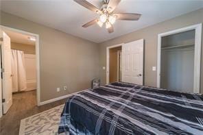 bedroom featuring a ceiling fan, baseboards, and a closet