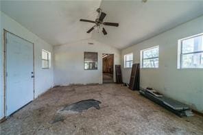 unfurnished living room featuring a ceiling fan and lofted ceiling