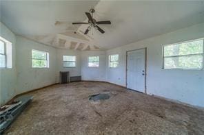 interior space featuring lofted ceiling and ceiling fan