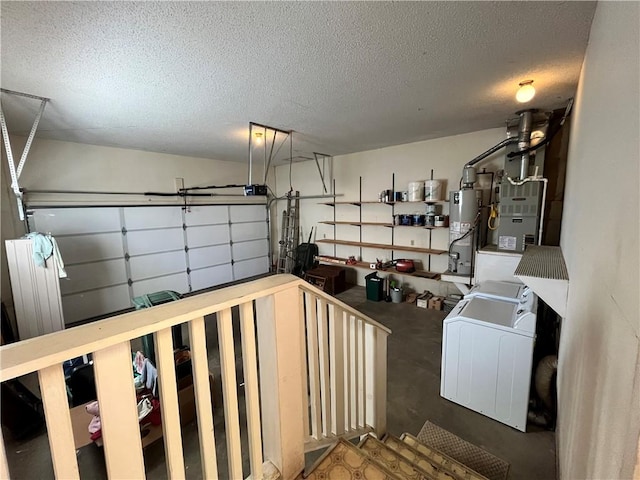 garage with washer / clothes dryer and gas water heater