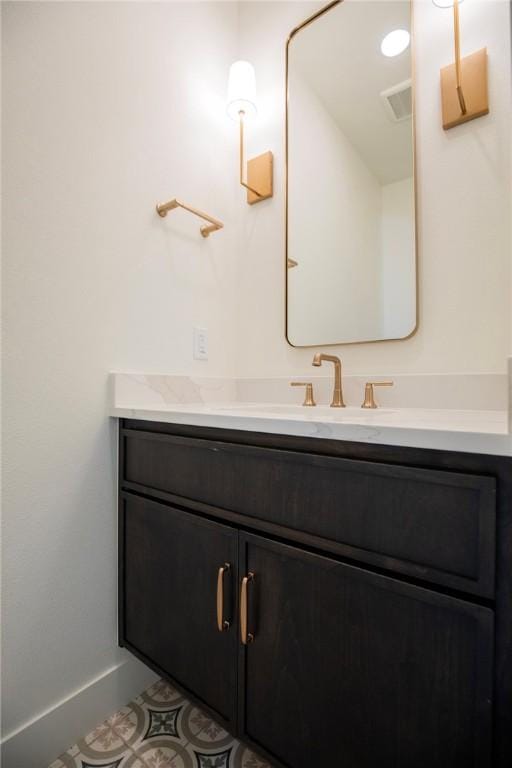 bathroom featuring vanity and baseboards