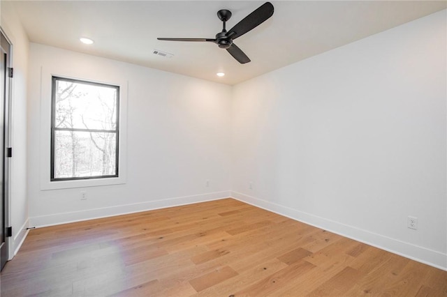 spare room with visible vents, baseboards, recessed lighting, ceiling fan, and light wood-type flooring