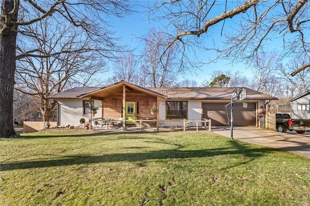 single story home featuring driveway, an attached garage, and a front yard