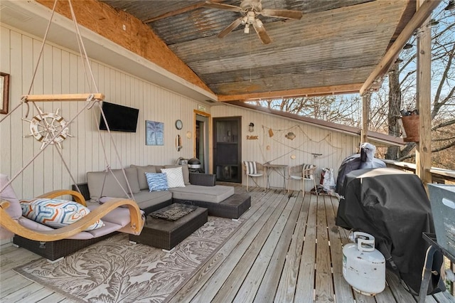 wooden deck featuring a grill, an outdoor hangout area, and ceiling fan