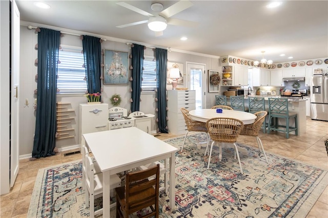 dining space featuring visible vents, ornamental molding, recessed lighting, ceiling fan with notable chandelier, and light tile patterned flooring