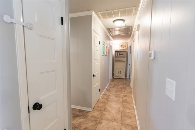 hall featuring light tile patterned floors and visible vents