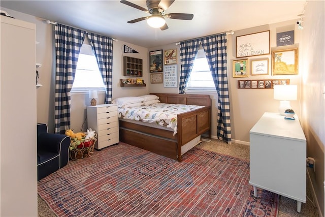 bedroom featuring a ceiling fan and baseboards