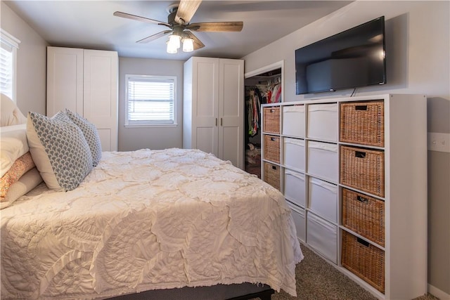 carpeted bedroom featuring a closet and a ceiling fan