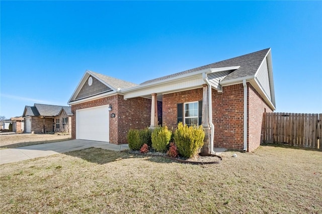 single story home with a garage, brick siding, driveway, and fence