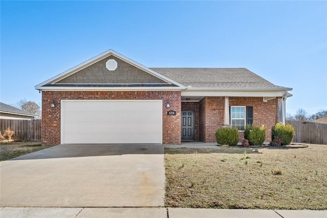 single story home with concrete driveway, brick siding, fence, and an attached garage