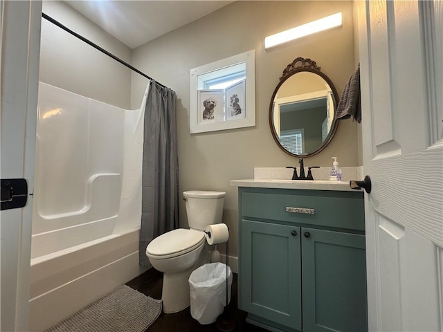 full bath featuring toilet, shower / bath combination with curtain, and vanity