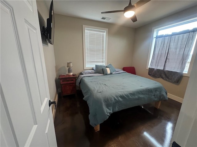 bedroom featuring baseboards, visible vents, and a ceiling fan