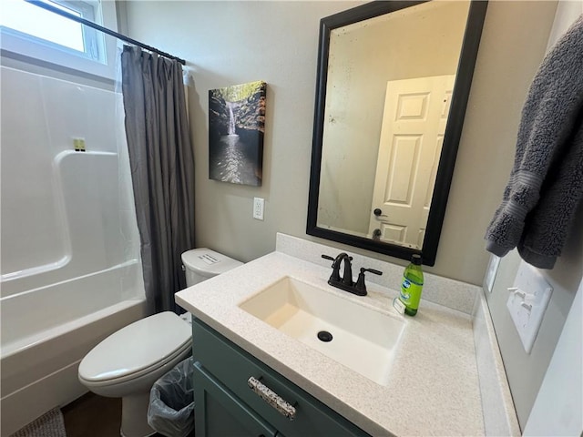 bathroom with shower / tub combo, vanity, and toilet