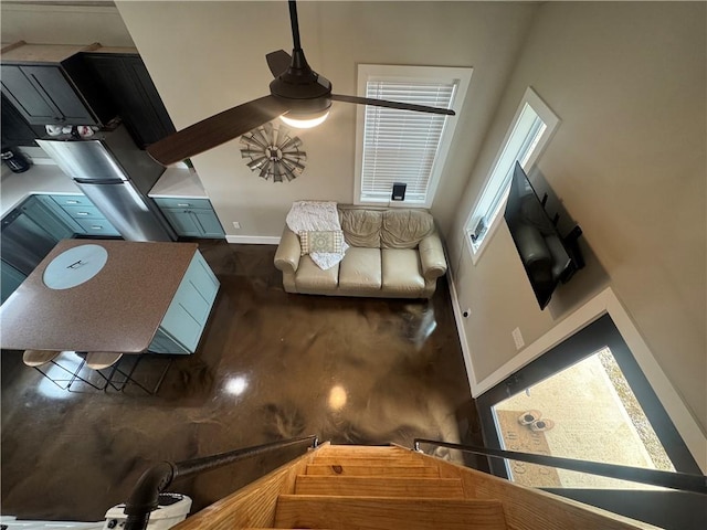 living room with baseboards and wood finished floors