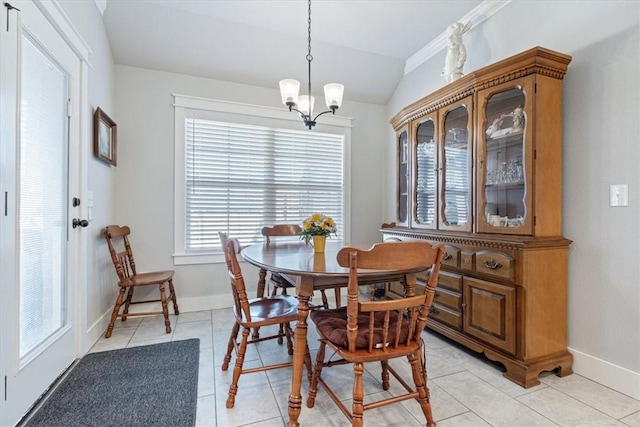 dining area featuring vaulted ceiling, light tile patterned floors, baseboards, and an inviting chandelier