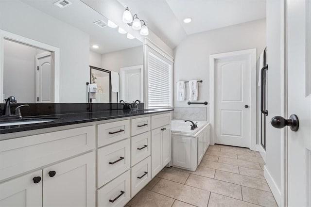 full bathroom featuring visible vents, a sink, a shower stall, and double vanity