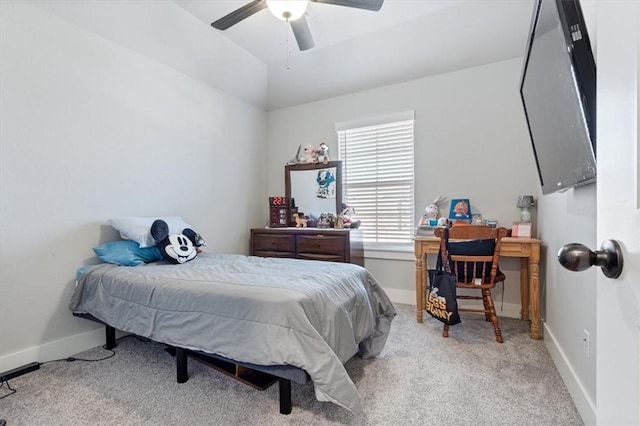 bedroom featuring ceiling fan, baseboards, vaulted ceiling, and carpet flooring