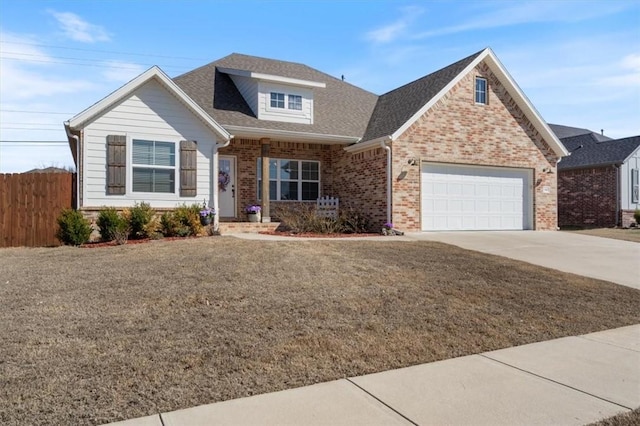 view of front facade with a garage, brick siding, fence, concrete driveway, and roof with shingles