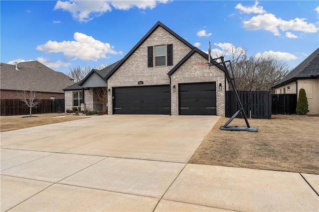 view of front of home with a garage, fence, concrete driveway, and brick siding